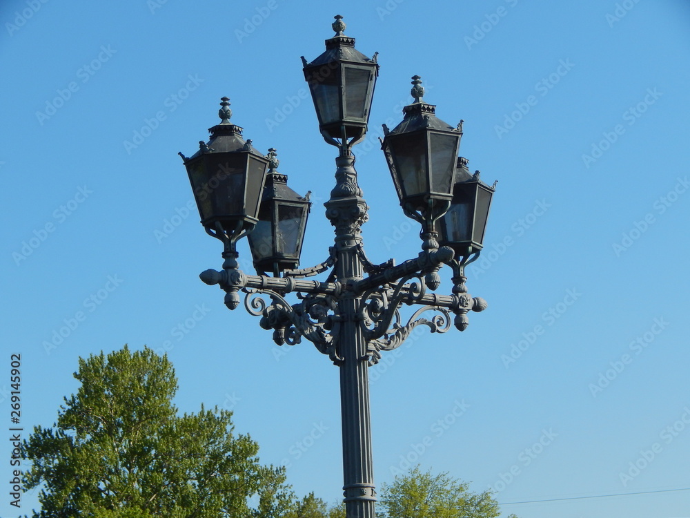 Street lamp with five heads against the blue sky Street lamp with five heads against the blue sky