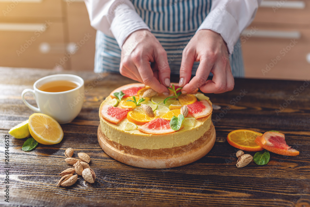 Raw citrus cake with grapefruit, orange, lime and lemon. Cooking healthy summer vegan dessert with vegetable ingredients