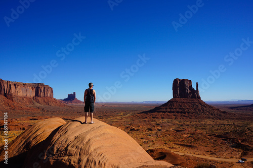 Man on top of the mountain Monument Valley