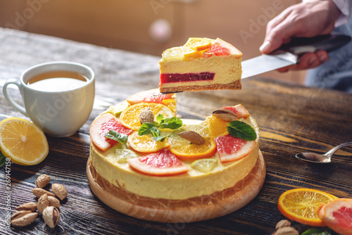 Raw citrus cake with grapefruit  orange  lime and lemon. Healthy summer dessert. Gluten free  no baking vegan food