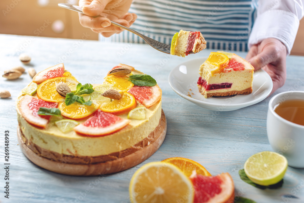 Raw citrus cake with grapefruit, orange, lime and lemon with nuts and mint. Cooking healthy fresh summer vegan dessert Raw citrus cake with grapefruit, orange, lime and lemon with nuts and mint. Cooking healthy fresh summer vegan dessert