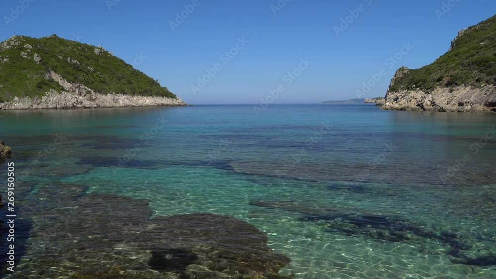 Smooth panning shot of the crystal clear waters of Porto Timoni beach on the Island of Corfu. Smooth panning shot of the crystal clear waters of Porto Timoni beach on the Island of Corfu.