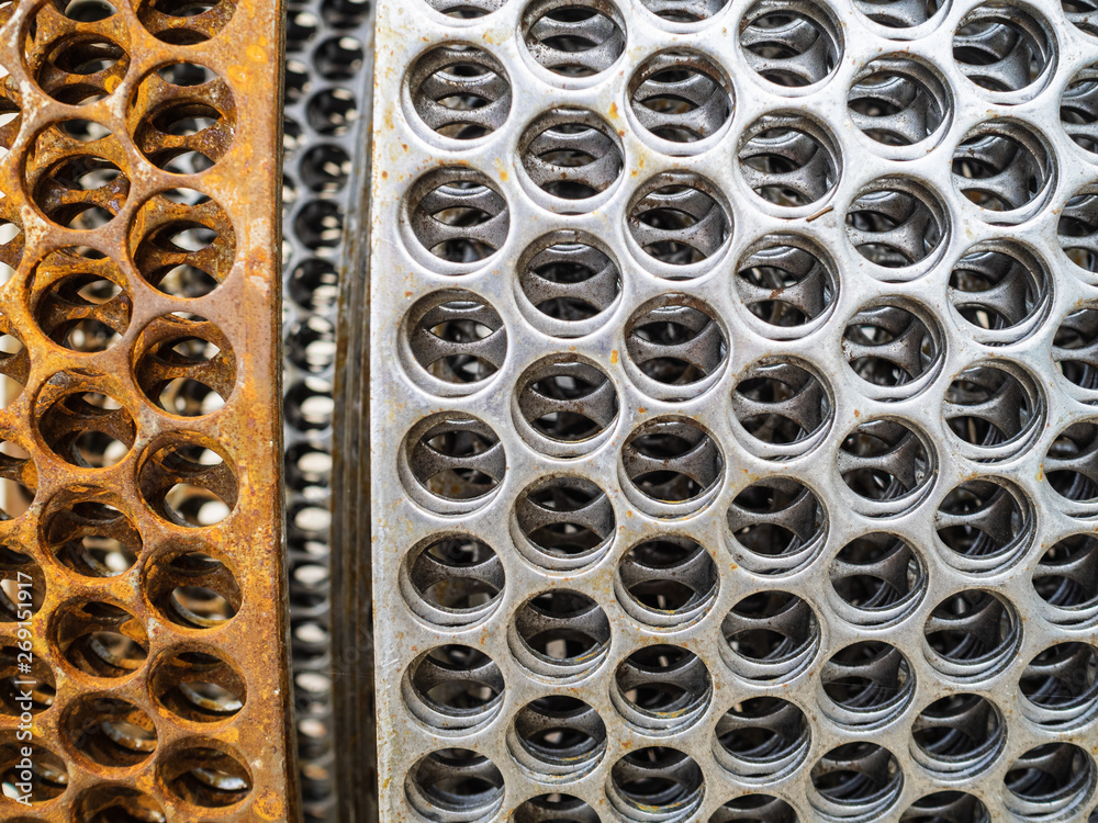 Metal coil for concrete reinforcement. Plate with holes for masonry blocks and bricks Metal coil for concrete reinforcement. Plate with holes for masonry blocks and bricks