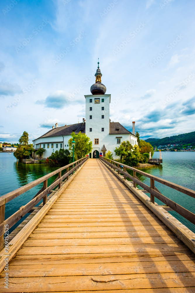 Amazing view of wooden bridge to the Schloss Ort castle and landscape around in Gmunden, Austria
