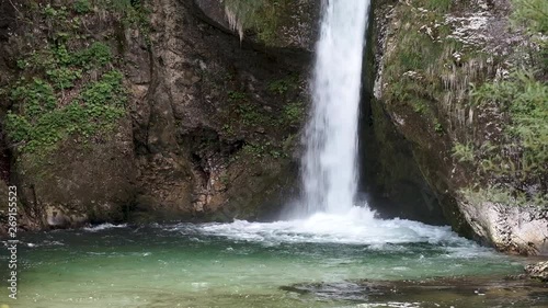 Waterfall in Slovenia - Waterfall Grmecica near Lake Bohinj in the Triglav National Park. Beautiful springtime in Slovenia in Europe with the Bohinjska Sava or Bohinj River flowing. photo