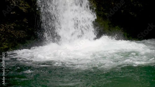 Waterfall in Slovenia - Waterfall Grmecica near Lake Bohinj in the Triglav National Park. Beautiful springtime in Slovenia in Europe with the Bohinjska Sava or Bohinj River flowing. photo