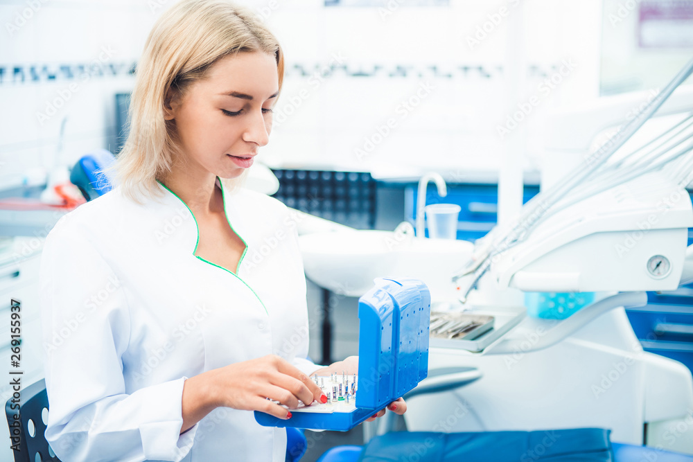 Fototapeta premium dental doctor in white uniform in stomathology office