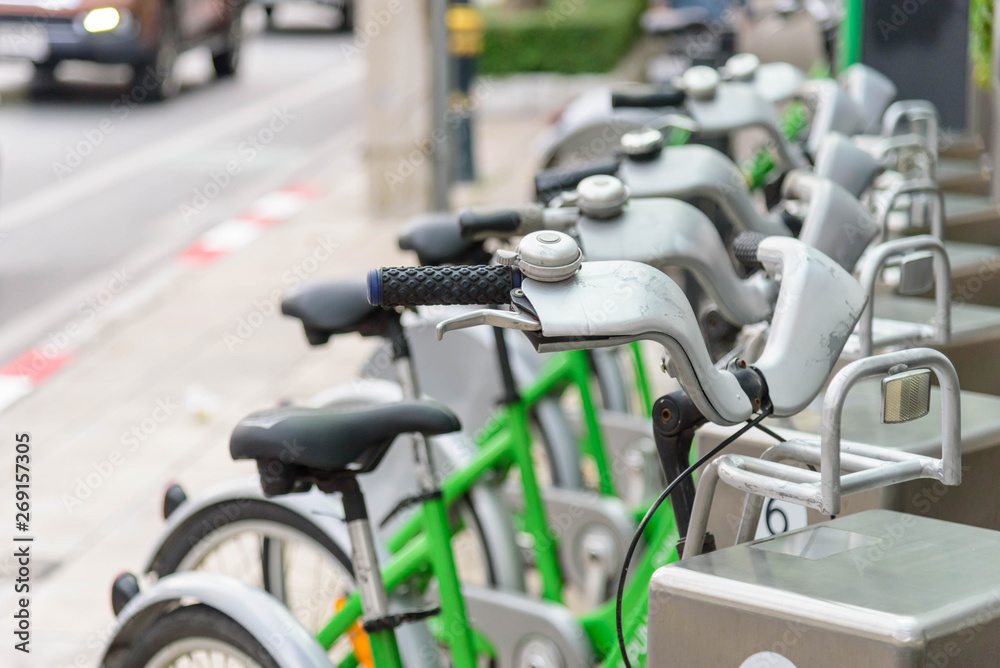 green bicycle for rent in city / bike for rent green bicycle for rent in city / bike for rent