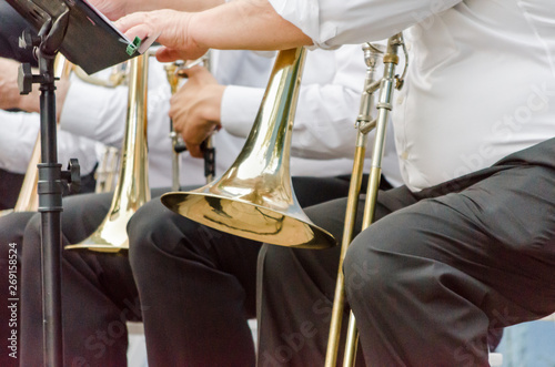 ands and trumpets of symphony orchestra musicians close up