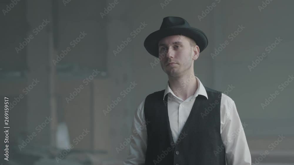 Portrait confident detective or mafia boss and gangster shooting with a pistol. Weapons in the hands of a solid business style men. Criminal authority portrait. Self-confident businessman relaxing. Portrait confident detective or mafia boss and gangster shooting with a pistol. Weapons in the hands of a solid business style men. Criminal authority portrait. Self-confident businessman relaxing.