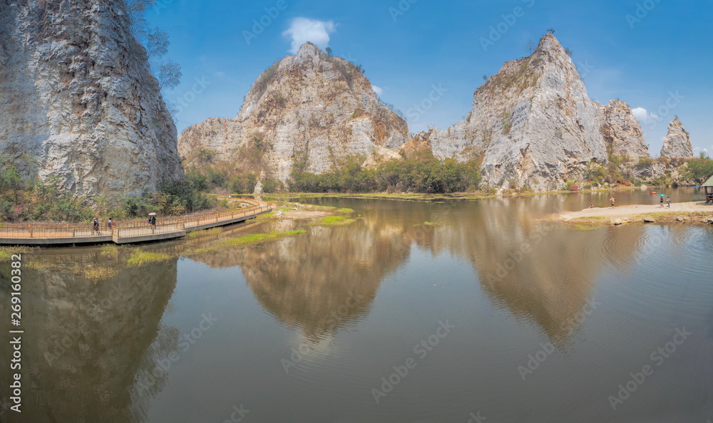 Panorama view morning of Khao Ngu Stone Park, beautiful big rock mountain with reflection on surface of water and blue sky background, famous attraction in Ratchaburi, Thailand. Panorama view morning of Khao Ngu Stone Park, beautiful big rock mountain with reflection on surface of water and blue sky background, famous attraction in Ratchaburi, Thailand.
