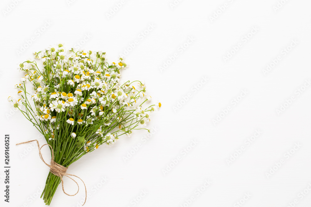 Chamomile flowers floral framee. Flat lay, top view. Chamomile flowers floral framee. Flat lay, top view.