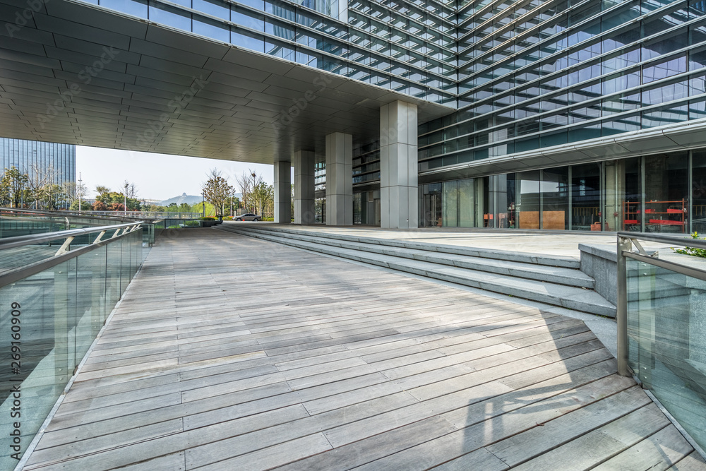 Empty wooden footpath front modern building. Empty wooden footpath front modern building.