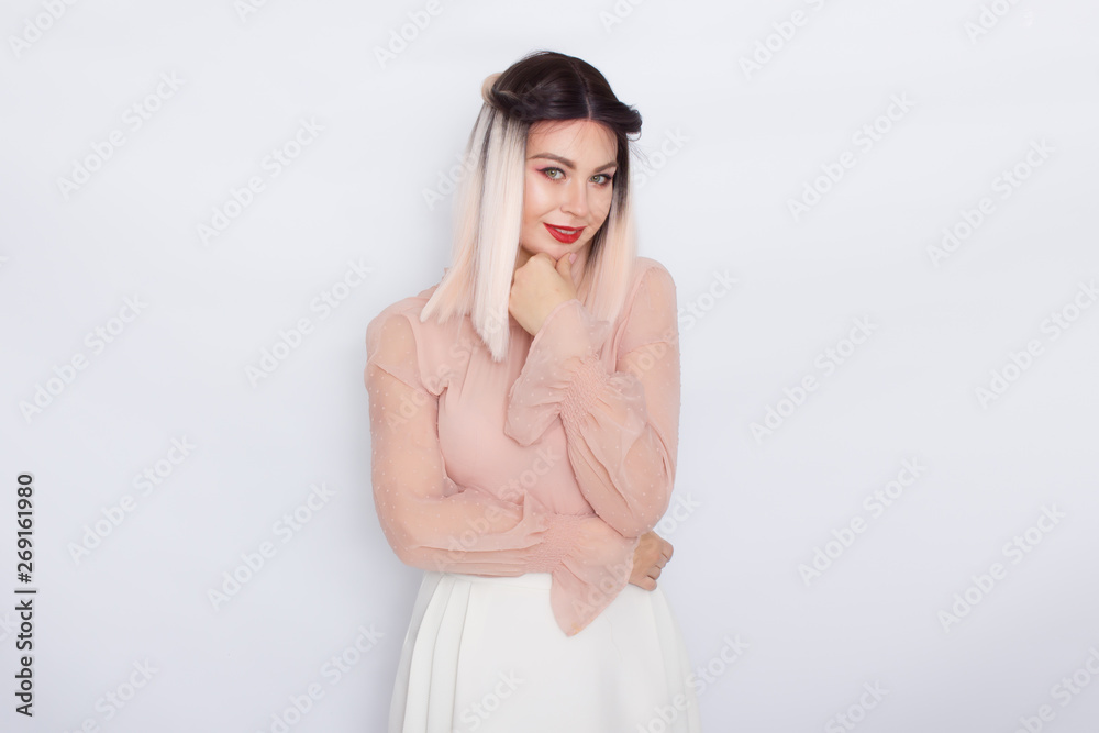 Romantic portrait of blonde woman in light pink blouse Romantic portrait of blonde woman in light pink blouse