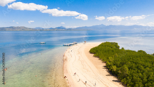 The island of white sand with mangroves. The sea landscape of Honda Bay, view from above. sand bar on coral reefs, Palawan, Philippines.