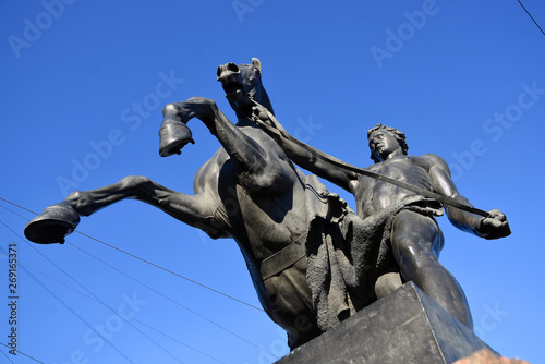 View of Horse tamers monument by Peter Klodt on Anichkov Bridge in Saint-Petersburg Russia. Popular touristic landmark.