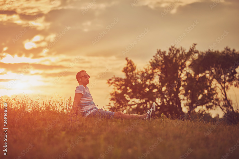 Man enjoying and relaxing in wheat field. Nature concept. Man enjoying and relaxing in wheat field. Nature concept.