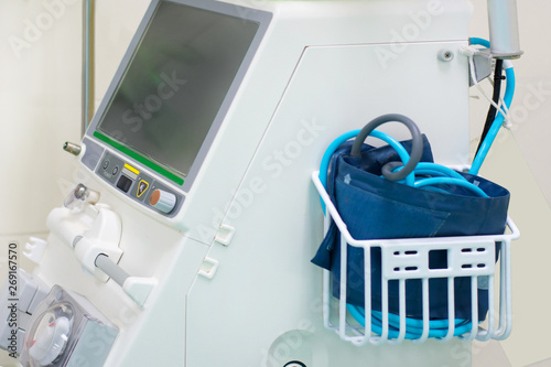 Close up digital vital signs of measuring heart and blood pressure monitor with elderly patient sleep on the bed in hospital room.