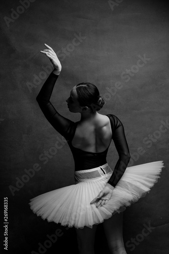 Fotografie one ballerina dancing on a retro background