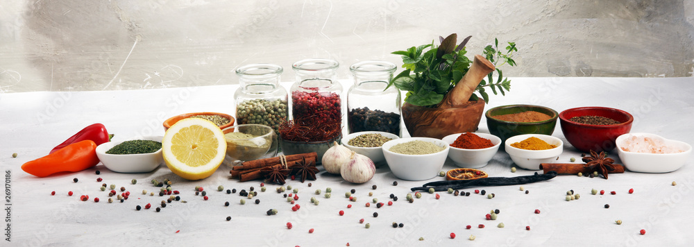 Fototapeta Spices and herbs on table. Food and cuisine ingredients with basil