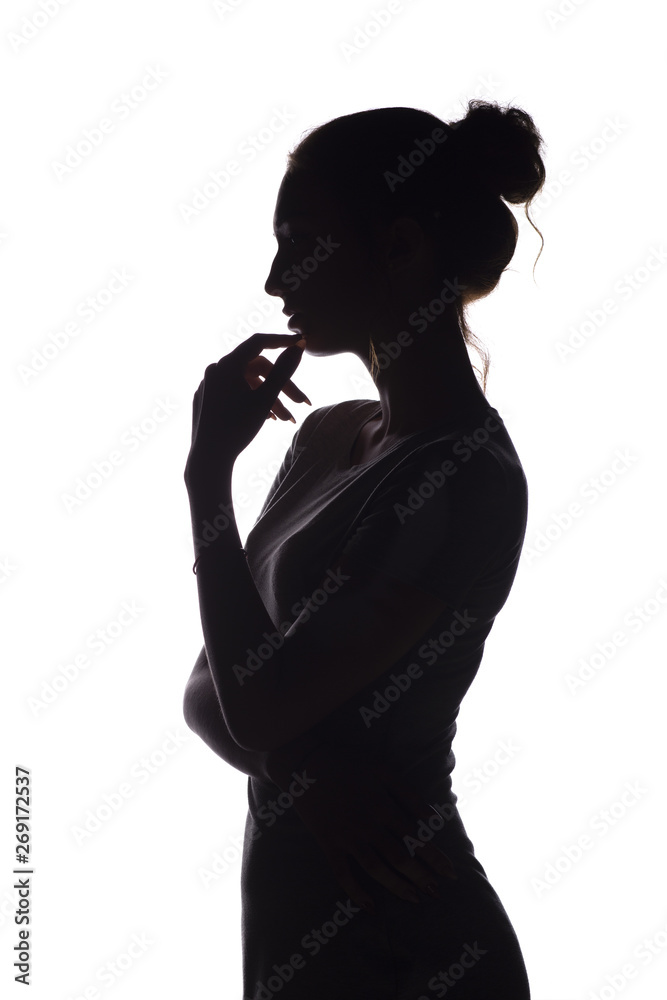 portrait profile of beautiful girl with hand-picked hair, silhouette of a woman on a white isolated background, concept beauty and fashion