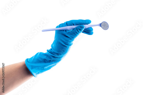 Hand in blue glove holding dental angled mirror isolated on white background photo