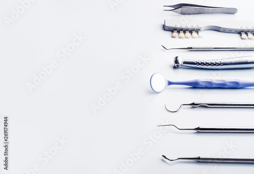 Dentistry instruments on white background with copy space