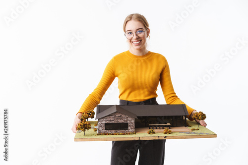 Attractive young woman architect standing