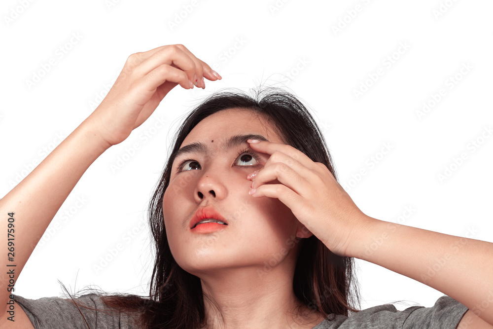Teen girl Wearing contact lenses for vision correction. Teen girl Wearing contact lenses for vision correction.