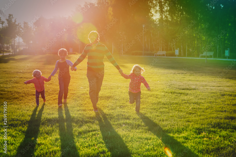 Fototapeta premium happy father with kids play in sunset nature