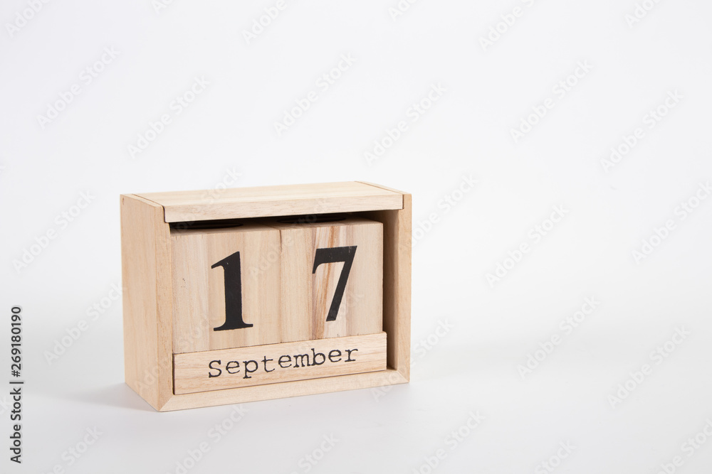 Wooden calendar September 17 on a white background Wooden calendar September 17 on a white background