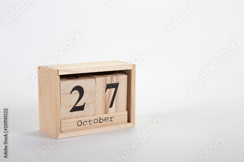 Wooden calendar October 27 on a white background