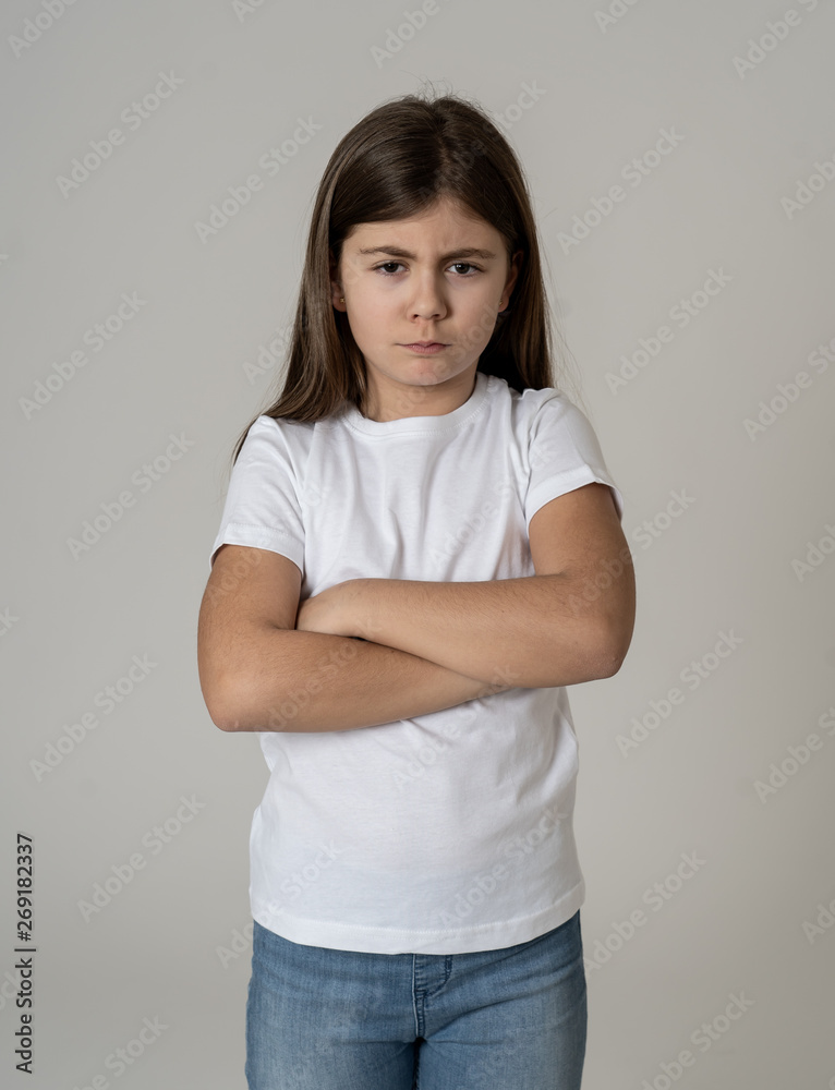 Pretty little girl with angry facial expression looking mad at the camera. Human emotions Pretty little girl with angry facial expression looking mad at the camera. Human emotions