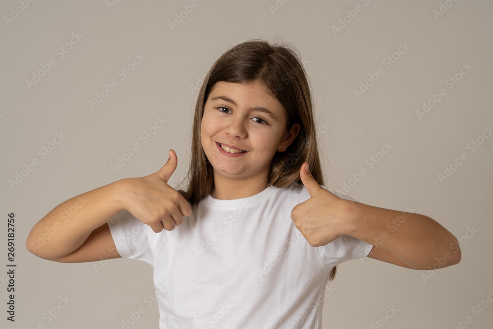 Cute pretty girl with happy face and thumbs up gesture. In human emotions and expressions Cute pretty girl with happy face and thumbs up gesture. In human emotions and expressions