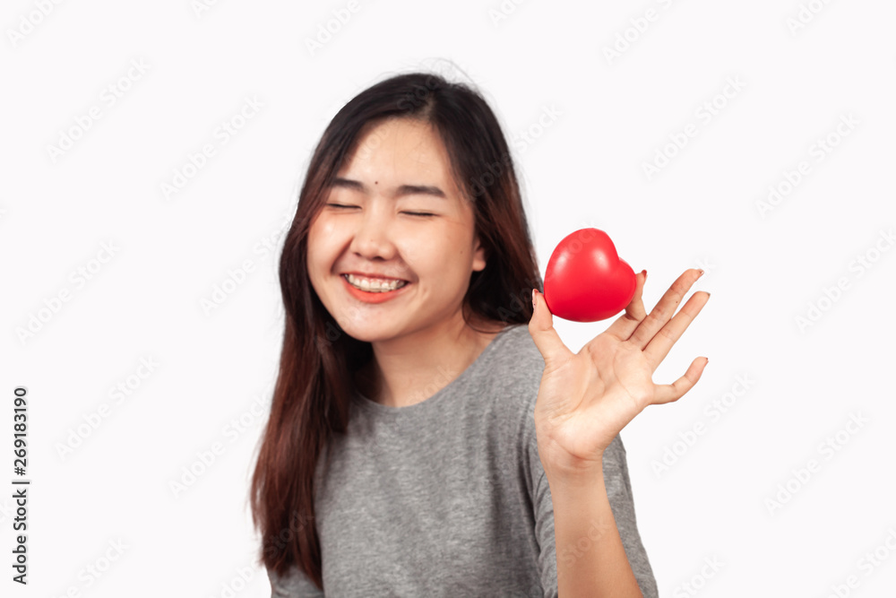 young woman holding red heart sign in hand,love concept. young woman holding red heart sign in hand,love concept.