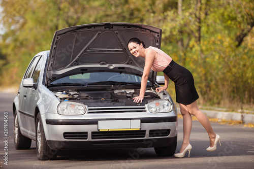 The young woman did not understand why the car does not go © artem_goncharov
