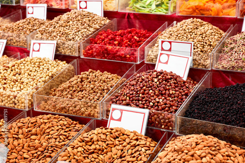 Various assorted nuts dried fruits on the counter of an authentic market