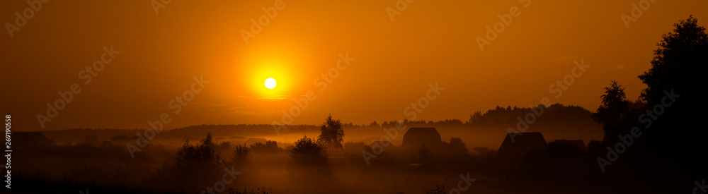 Orange sunrise and morning fog at the village, Russia, Mari El