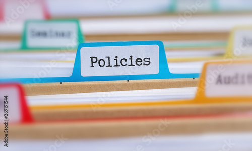 File folders with a tab labeled Policies photo