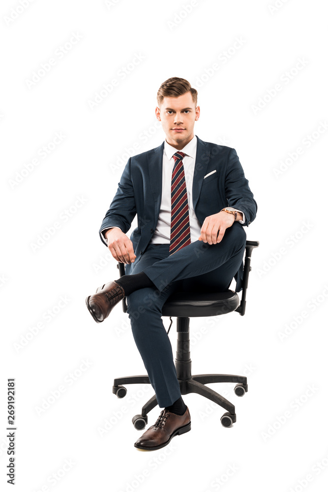 confident businessman sitting on chair and looking at camera isolated on white confident businessman sitting on chair and looking at camera isolated on white