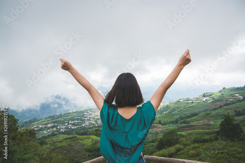 Happy young cute Asian Japanese girl hipster backpack women travelling looking at beautiful sky mountains scenery views 