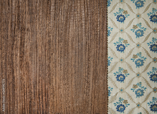 Floral green fabric on old wood background