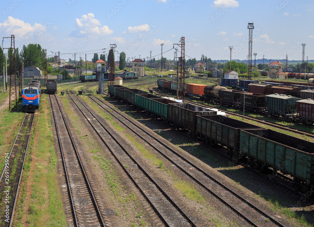 Freight trains on city cargo terminal. Railways in train parking. Arain arrived at the station. Cargo train platform with freight train container at depot in port use for export logistics background. Freight trains on city cargo terminal. Railways in train parking. Arain arrived at the station. Cargo train platform with freight train container at depot in port use for export logistics background.