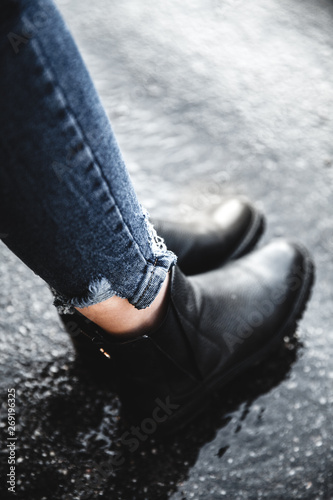 women's shoes and jeans on the beach in the sand photo