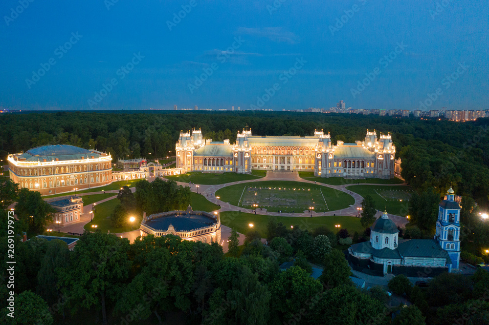 Fototapeta premium palace in the evening with city on horizon