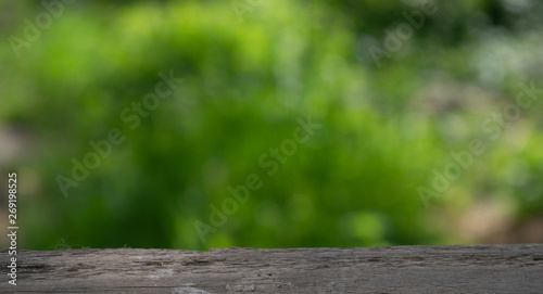 wooden table on blurred background of nature of forest and park