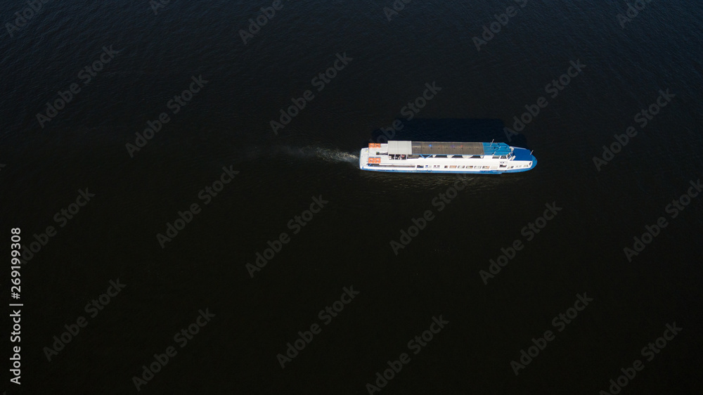 Fototapeta premium Large transport ship sailing on the river, top view
