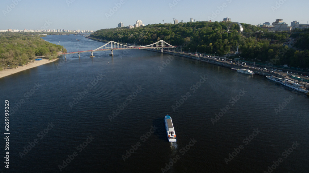 Large transport ship sailing on the river, top view