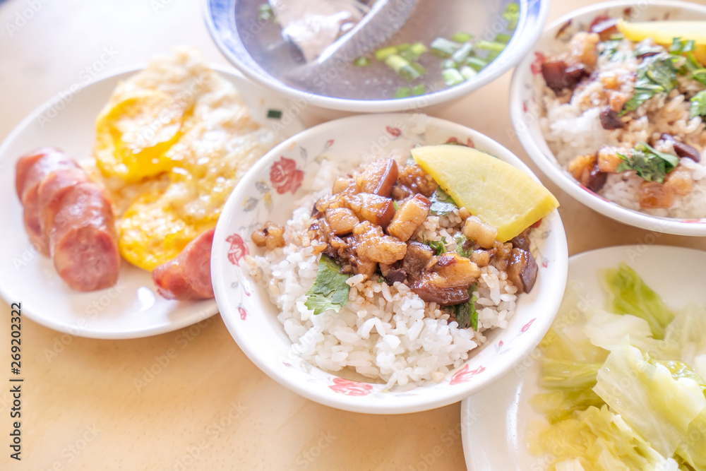 Braised pork over rice - Taiwan famous traditional street food delicacy. Soy-stewed pork on rice. Travel design concept. Top view,copy space,close up Braised pork over rice - Taiwan famous traditional street food delicacy. Soy-stewed pork on rice. Travel design concept. Top view,copy space,close up