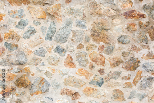 Old rough stone wall. Rock gray background.